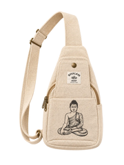 A beige canvas sling bag with a wide adjustable strap, featuring a front pocket with a black line art illustration of a meditating Buddha and a white 'BHALAM ART DESIGN' brand label. The bag is photographed flat on a light cream background.