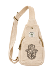 A beige canvas sling bag with a black Hamsa hand and lotus flower graphic on the front pocket, featuring a white brand label that reads 'HIMALAYAS BENGAL'.