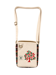 A canvas crossbody bag with a cream-colored body, a colorful geometric patterned trim, and a red and green tree graphic on the front. The bag features a gold-tone metal ring and an adjustable shoulder strap, set against a plain off-white background.