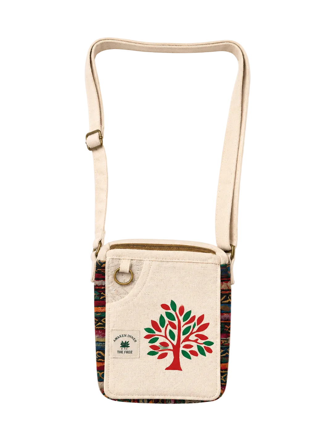 A canvas crossbody bag with a cream-colored body, a colorful geometric patterned trim, and a red and green tree graphic on the front. The bag features a gold-tone metal ring and an adjustable shoulder strap, set against a plain off-white background.