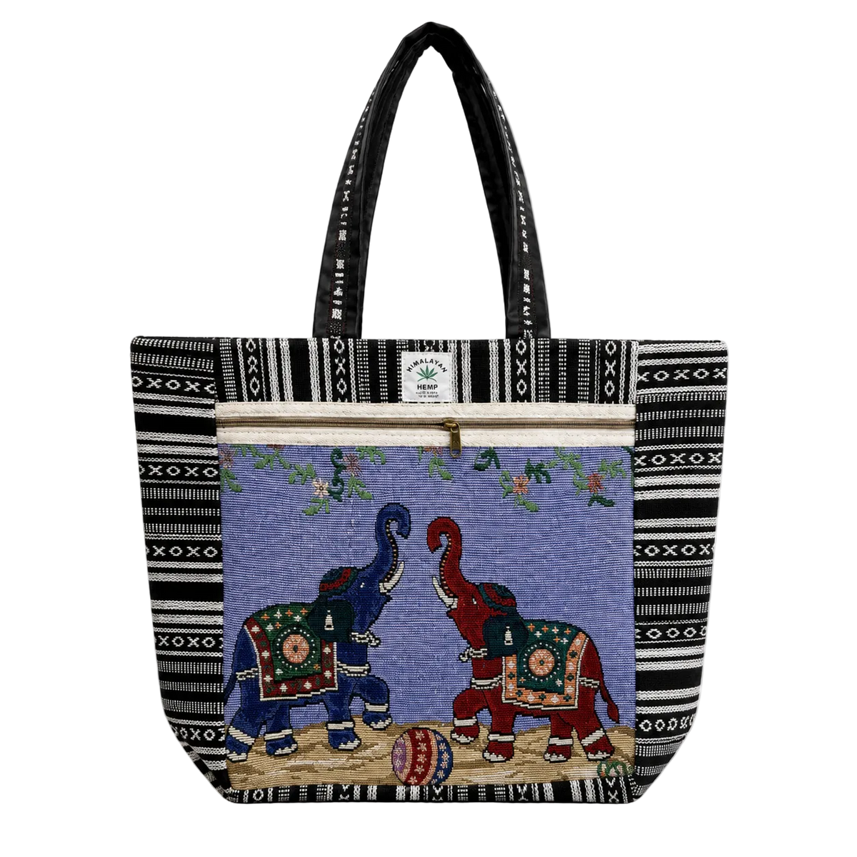 A tote bag with black and white geometric patterned borders, featuring a central tapestry-style panel with two elephants facing each other on a purple background. The handles are black with white text, and a small white brand label is visible near the top zipper.