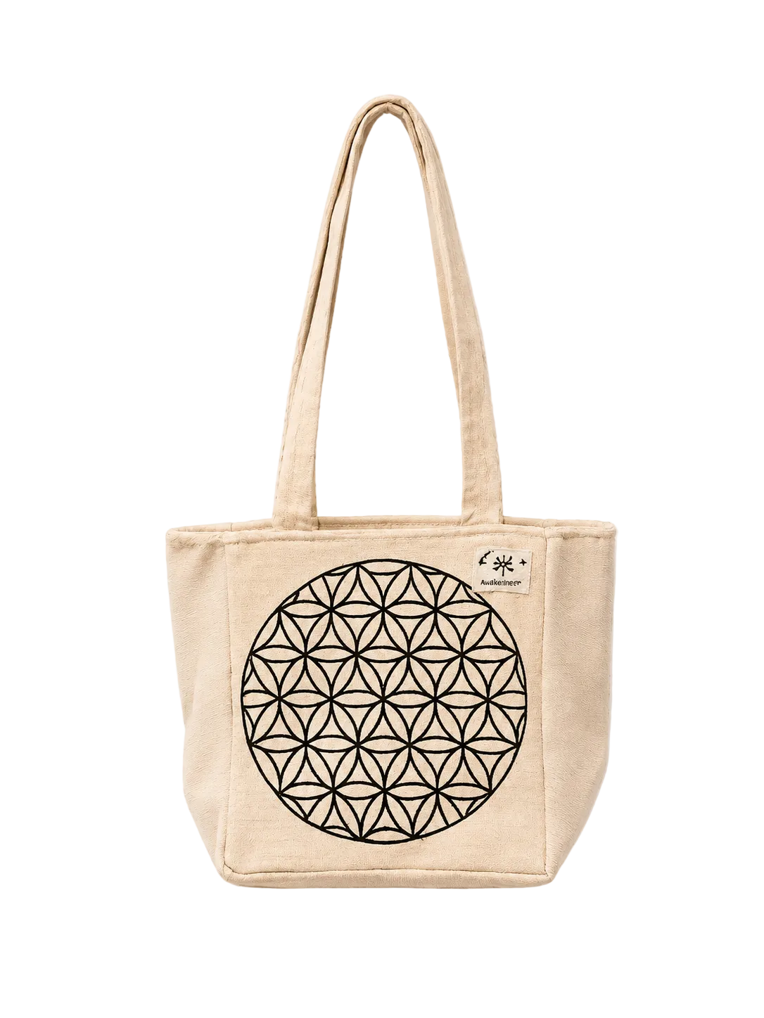 A beige canvas tote bag with a black geometric flower-of-life style circle printed on the front, featuring dual shoulder straps and a small sewn label on the upper right side, shown against a plain off-white background.